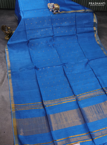 Munga tussar silk saree cs blue with allover zari woven buttas and zari woven border