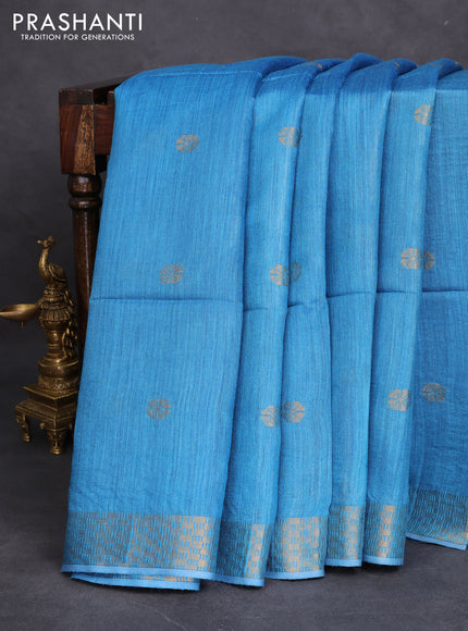 Munga tussar silk saree cs blue with allover zari woven buttas and zari woven border