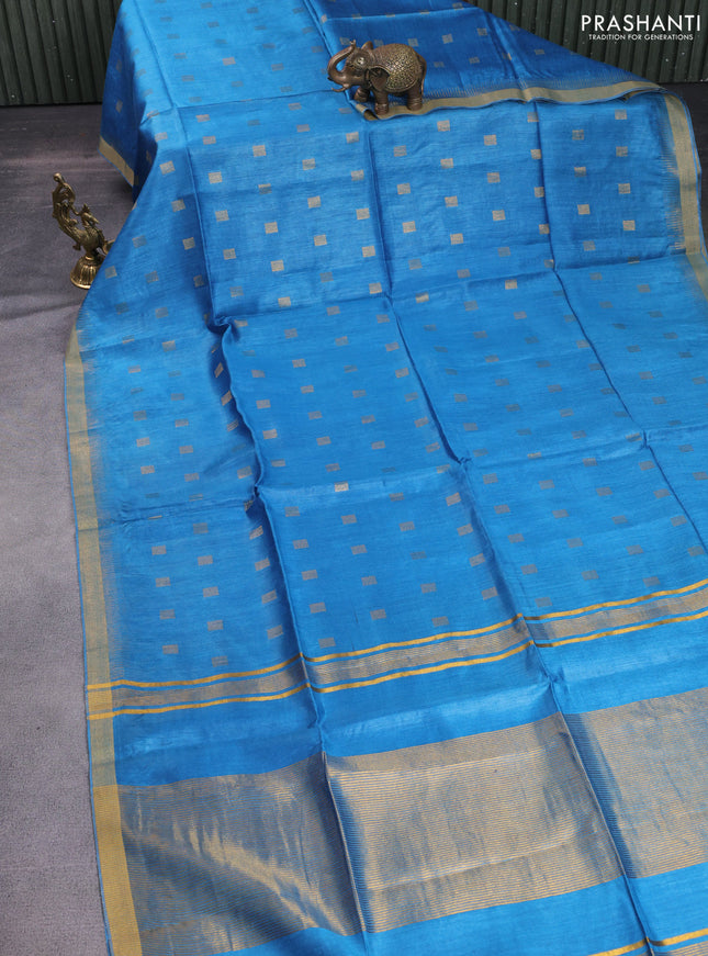 Munga tussar silk saree cs blue with allover zari woven buttas and zari woven border