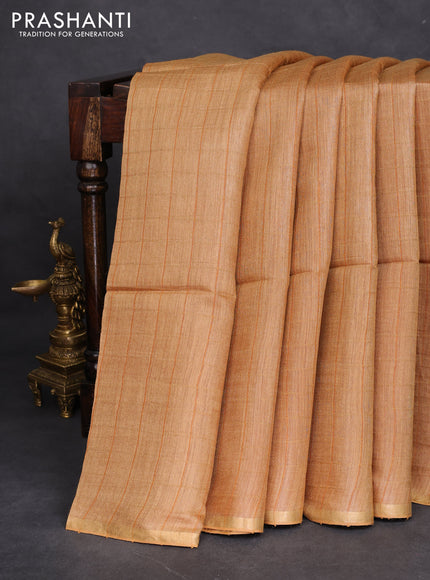 Munga tussar silk saree sandal with allover checked pattern and zari woven border