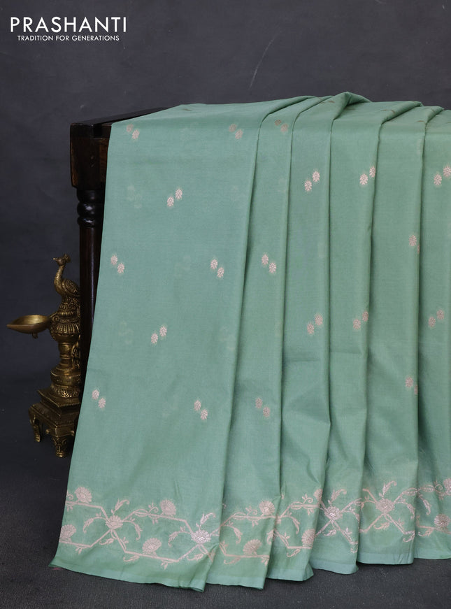 Banarasi semi katan saree pastel green with allover woven buttas and woven border