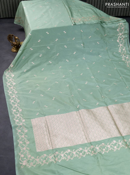 Banarasi semi katan saree pastel green with allover woven buttas and woven border