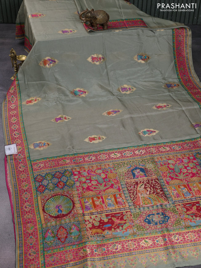 Banarasi silk saree elaichi green with position butta prints and position prints