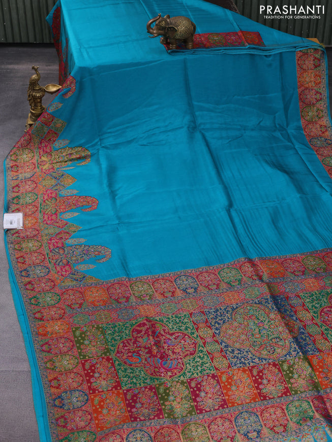 Banarasi silk saree teal blue with plain body and position prints