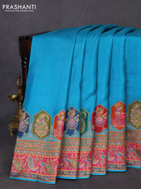 Banarasi silk saree teal blue with plain body and position prints