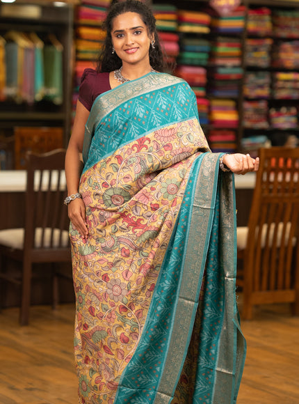 Matka tussar saree lime yellow and teal green with allover kalamkari prints and zari woven border