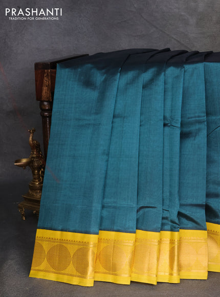Silk cotton saree peacock green shade and mustard yellow with plain body and rudhraksha zari woven korvai border
