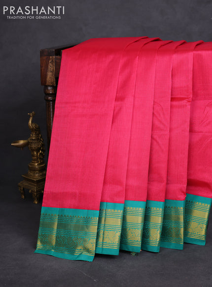 Silk cotton saree pink and teal green with plain body and zari woven korvai border