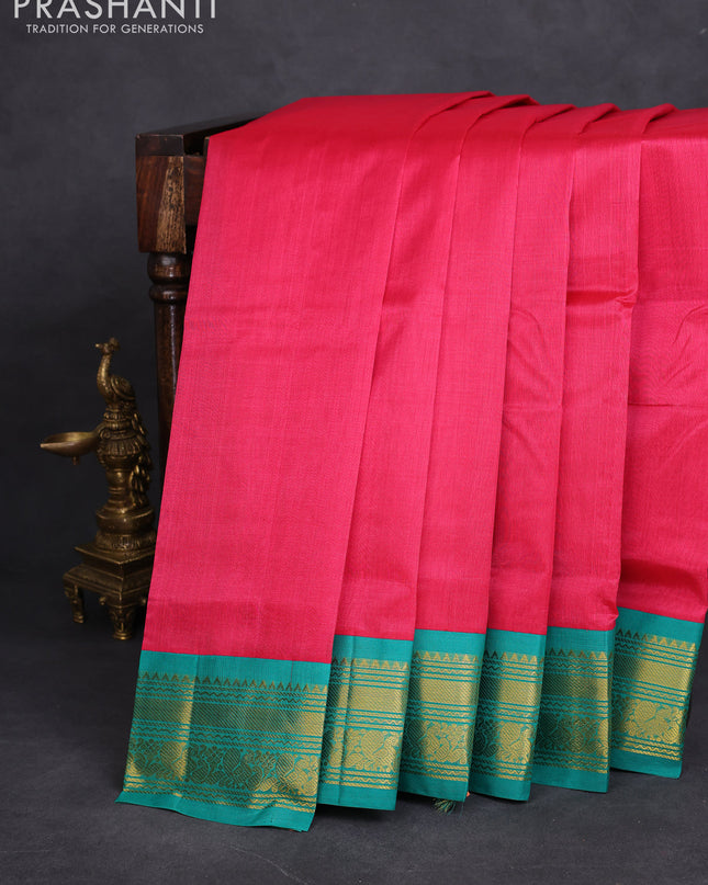 Silk cotton saree pink and teal green with plain body and zari woven korvai border