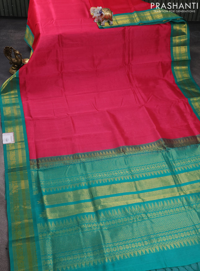 Silk cotton saree pink and teal green with plain body and zari woven korvai border