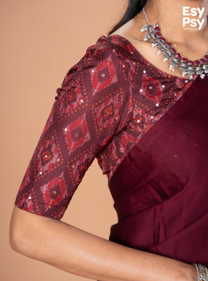Maroon Satin Crepe readymade saree with readymade ikat printed blouse