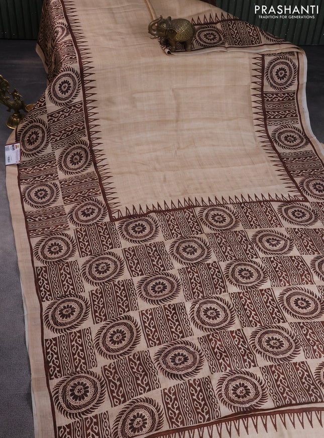 Printed silk saree sandal and brown with plain body and long printed border