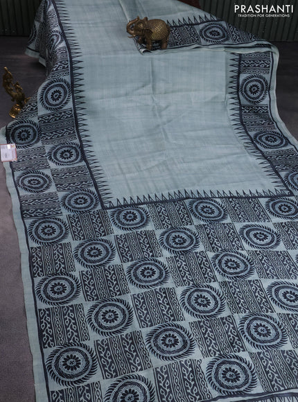 Printed silk saree pastel blue with plain body and long printed border