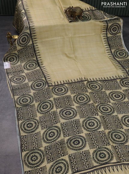 Printed silk saree beige and black with plain body and long printed border