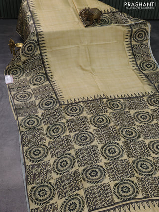 Printed silk saree beige and black with plain body and long printed border