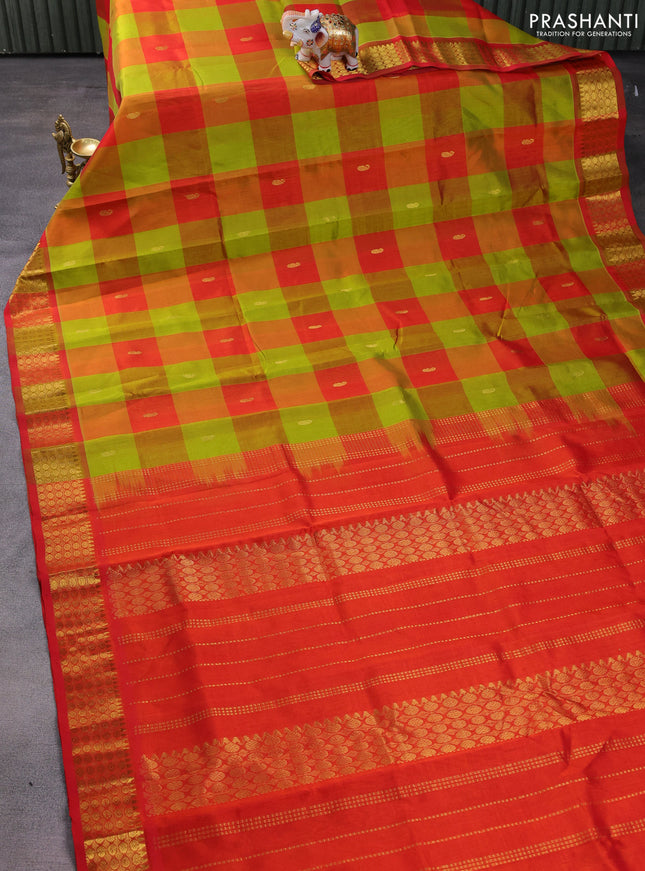 Silk cotton saree light green and orange with allover paalum pazhamum checks & zari buttas and zari woven border