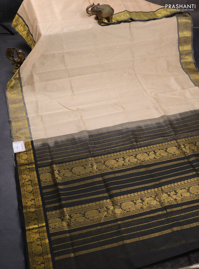 Silk cotton saree beige and black with allover vairosi pattern & buttas and zari woven border
