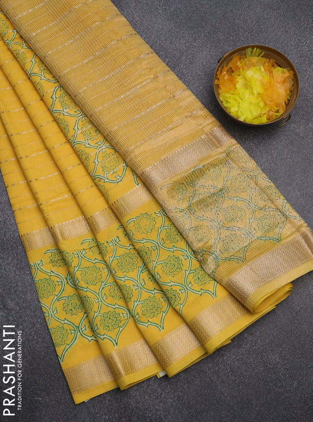 Semi chanderi saree yellow with allover zari weaves and long printed zari border