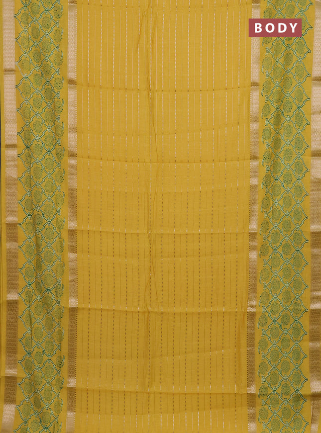 Semi chanderi saree yellow with allover zari weaves and long printed zari border