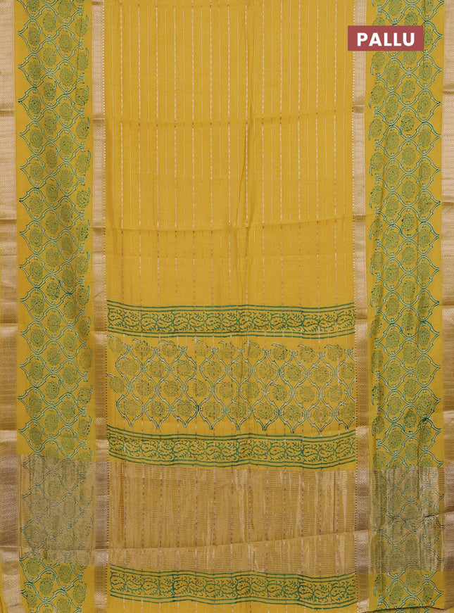 Semi chanderi saree yellow with allover zari weaves and long printed zari border
