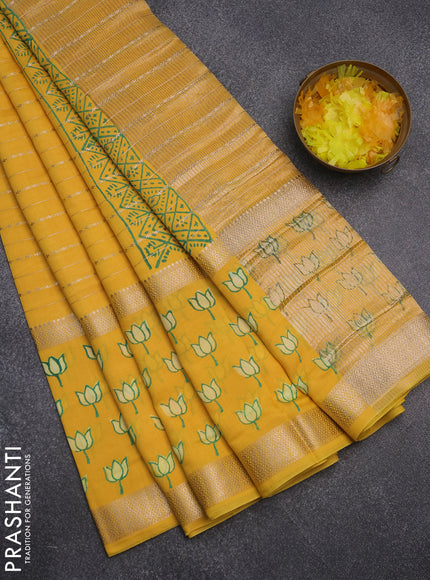Semi chanderi saree yellow with allover zari weaves and long printed zari border