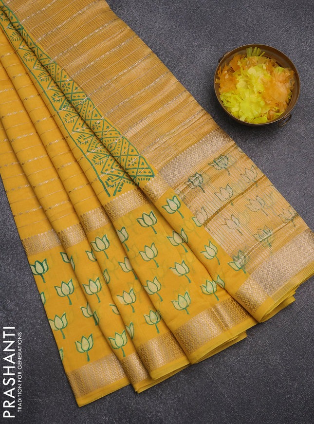 Semi chanderi saree yellow with allover zari weaves and long printed zari border