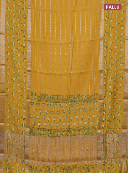 Semi chanderi saree yellow with allover zari weaves and long printed zari border