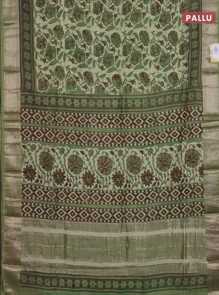 Semi chanderi saree pista green and green with allover kalamkari prints and zari woven border