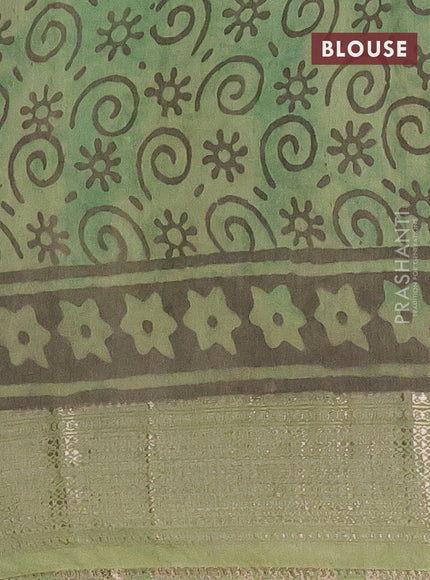 Semi chanderi saree pista green and green with allover kalamkari prints and zari woven border