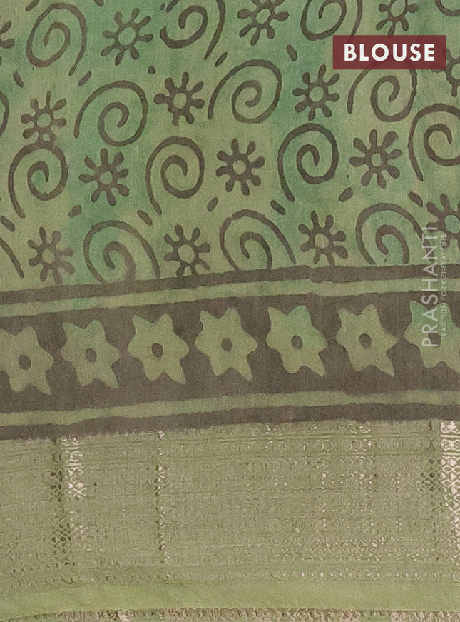 Semi chanderi saree pista green and green with allover kalamkari prints and zari woven border