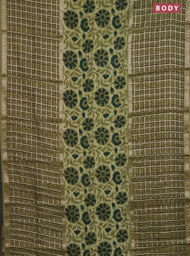 Semi chanderi saree pista green with allover kalamkari prints and long printed zari border