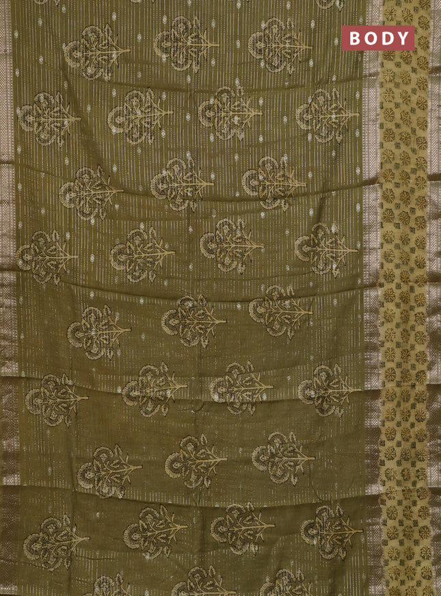 Semi chanderi saree sap green shade with allover butta prints & zari weaves and long printed zari border