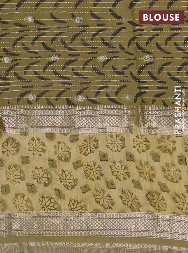 Semi chanderi saree sap green shade with allover butta prints & zari weaves and long printed zari border