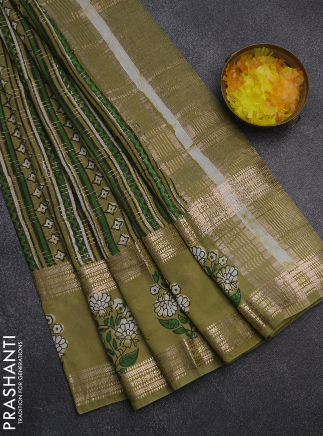 Semi chanderi saree sap green and green with allover prints & zari weaves and long floral butta printed zari border