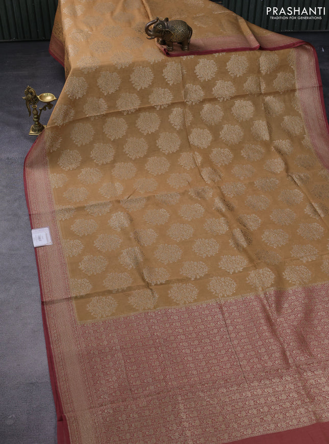 Banarasi tissue silk cotton saree sandal and maroon with zari woven buttas and woven border