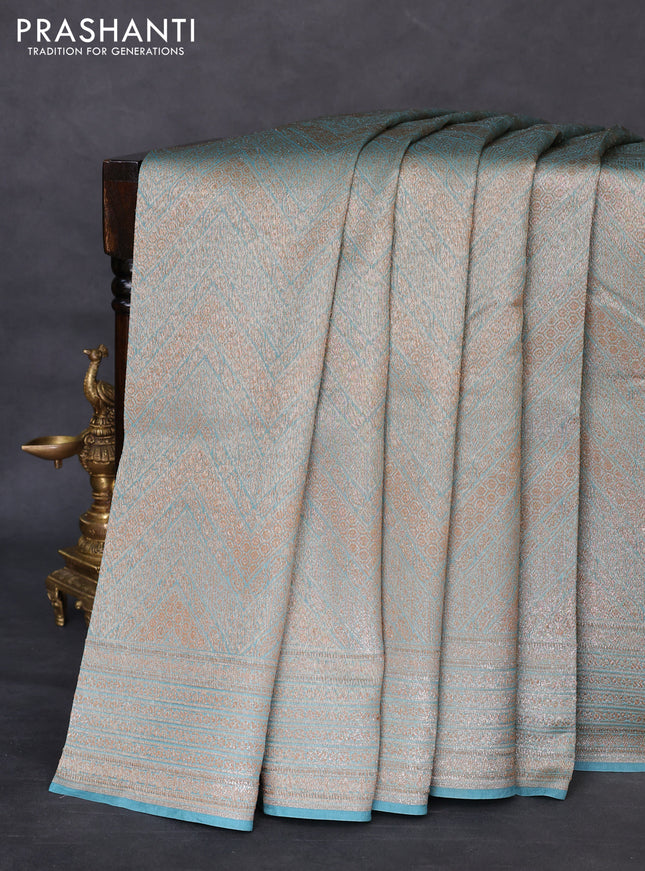 Banarasi silk cotton saree teal blue with allover brocade zari weaves and woven border