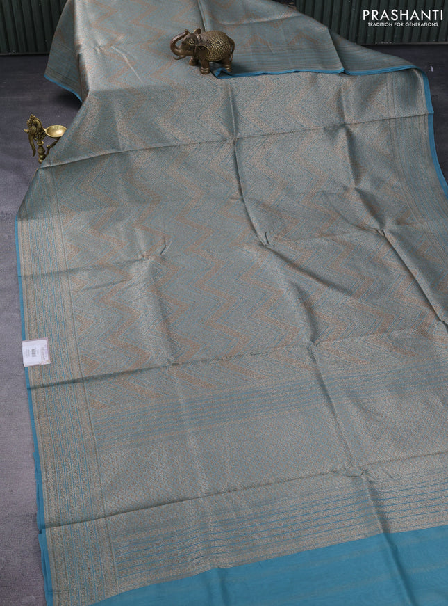 Banarasi silk cotton saree teal blue with allover brocade zari weaves and woven border