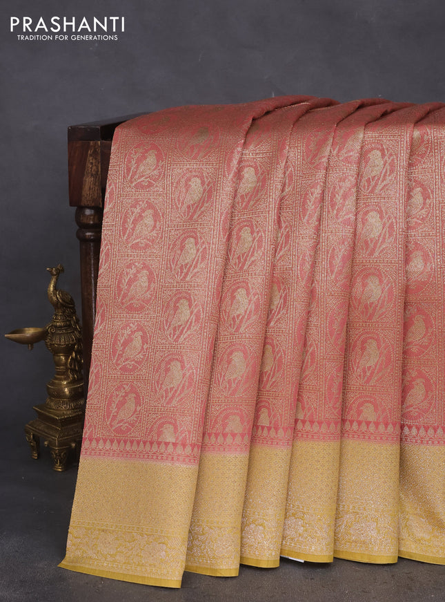 Banarasi silk cotton saree pink shade and yellow with allover thread & zari woven brocade weaves and woven border