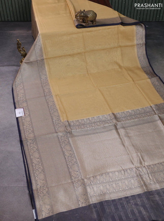 Banarasi tissue silk cotton saree sandal and navy blue with plain body and long woven border