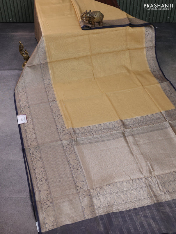 Banarasi tissue silk cotton saree sandal and navy blue with plain body and long woven border