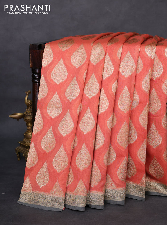 Banarasi silk cotton saree peach orange and grey with woven buttas and woven border