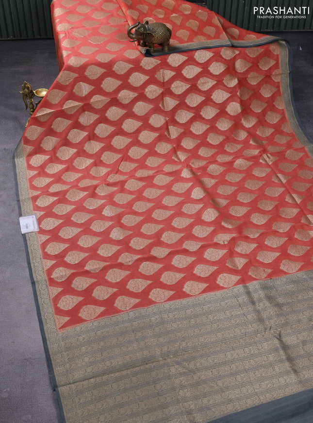 Banarasi silk cotton saree peach orange and grey with woven buttas and woven border