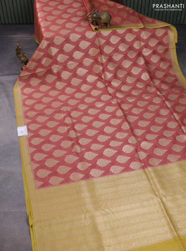 Banarasi silk cotton saree peach shade and yellow with woven buttas and woven border