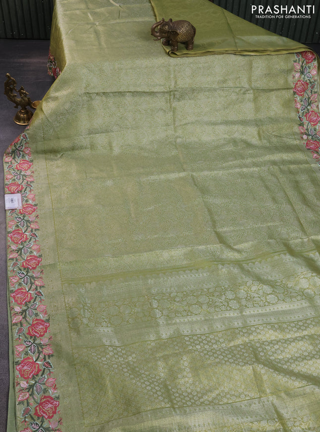 Semi kanchipuram tissue silk saree lime green with allover zari woven brocade weaves and floral design embroidery border