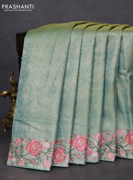 Semi kanchipuram tissue silk saree green shade with allover zari woven brocade weaves and floral design embroidery border
