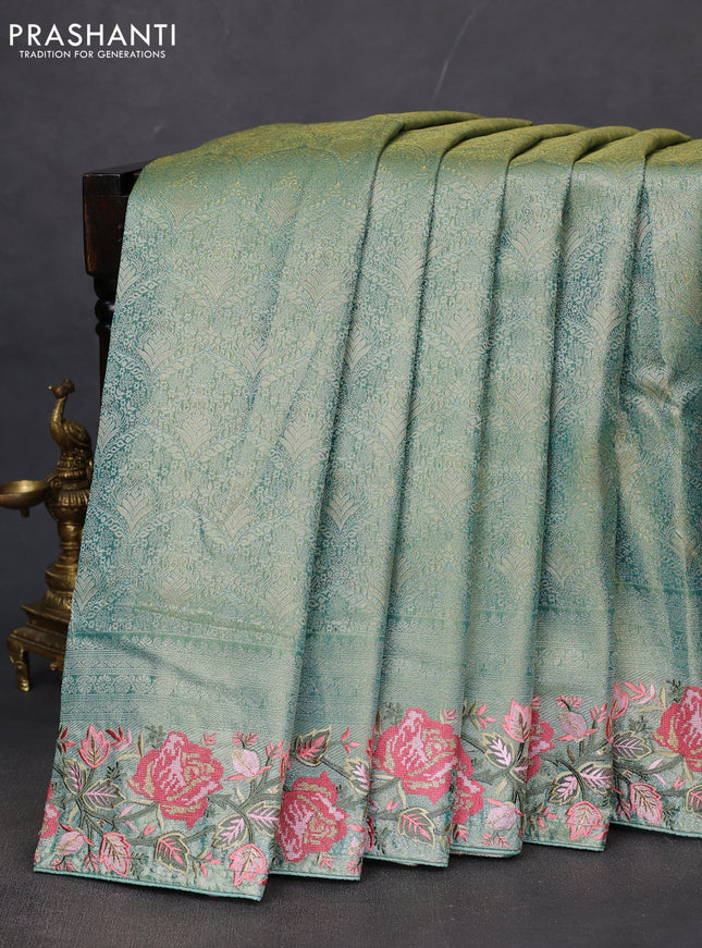 Semi kanchipuram tissue silk saree green shade with allover zari woven brocade weaves and floral design embroidery border