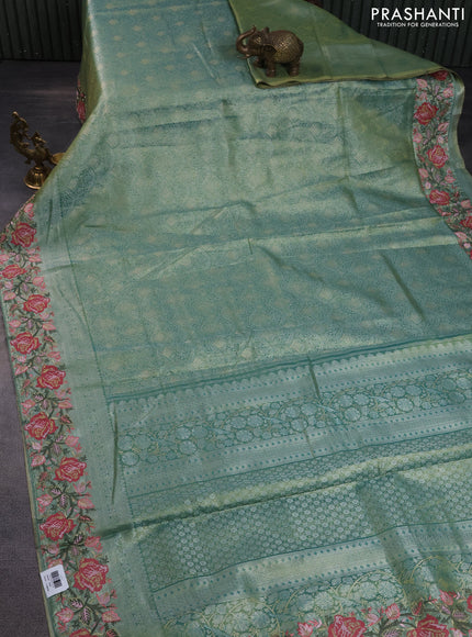 Semi kanchipuram tissue silk saree green shade with allover zari woven brocade weaves and floral design embroidery border