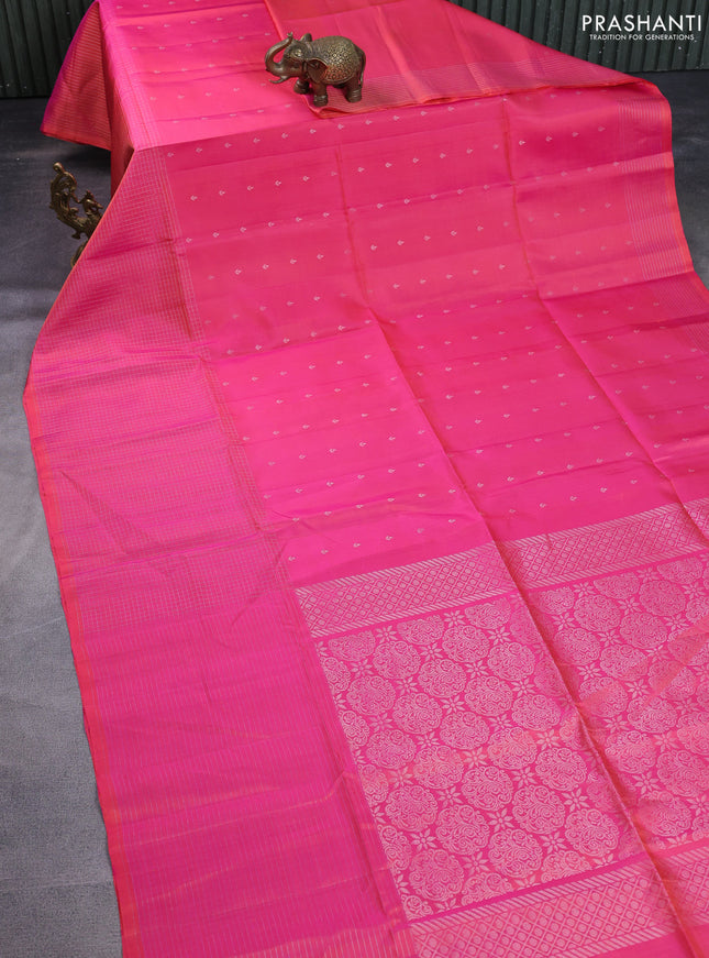 Pure soft silk saree dual shade of pinkish orange with allover silver zari buttas and long zari checked border