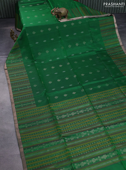 Pure soft silk saree green with allover silver zari buttas and long zari checked border