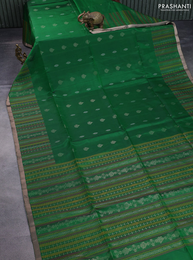 Pure soft silk saree green with allover silver zari buttas and long zari checked border